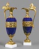 An extremely fine pair of Louis XVI gilt bronze mounted blue enamel ewers